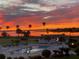 Community pool with lake view at sunrise at 1600 W Lake Parker Dr # C25, Lakeland, FL 33805
