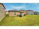 Spacious backyard with grassy area, ideal for outdoor activities at 1713 Yellow Trl, Lakeland, FL 33801