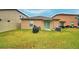 Spacious backyard with a grill and AC unit at 1713 Yellow Trl, Lakeland, FL 33801