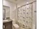 Bathroom with shower/tub combo and patterned shower curtain at 1713 Yellow Trl, Lakeland, FL 33801