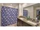 Bathroom with double sinks, shower, and granite countertop at 1713 Yellow Trl, Lakeland, FL 33801