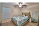 Bedroom with a queen bed, ceiling fan, and window blinds at 1713 Yellow Trl, Lakeland, FL 33801