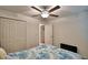 Bedroom with a queen bed, ceiling fan, and access to a bathroom at 1713 Yellow Trl, Lakeland, FL 33801