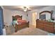Bright bedroom with double bed, dresser, and ceiling fan at 1713 Yellow Trl, Lakeland, FL 33801