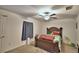 Bedroom with double bed, ceiling fan and window coverings at 1713 Yellow Trl, Lakeland, FL 33801