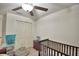 Bedroom with crib, ceiling fan, and double door closet at 1713 Yellow Trl, Lakeland, FL 33801