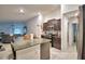 Open kitchen with island, granite countertops, and stainless steel appliances at 1713 Yellow Trl, Lakeland, FL 33801