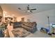 Spacious living room with sectional sofa and open concept to kitchen at 1713 Yellow Trl, Lakeland, FL 33801
