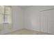 Simple bedroom with neutral colors and double doors at 176 Brookshire Dr, Lake Wales, FL 33898