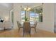 Charming breakfast nook with a glass table and four grey chairs at 176 Brookshire Dr, Lake Wales, FL 33898