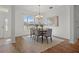 Charming dining room with hardwood floors and a beautiful chandelier at 176 Brookshire Dr, Lake Wales, FL 33898