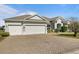 Single-story house with three-car garage and paved driveway at 176 Brookshire Dr, Lake Wales, FL 33898