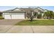 Two-story house with a two-car garage and landscaped lawn at 176 Brookshire Dr, Lake Wales, FL 33898