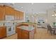 Open kitchen featuring wood cabinets, island, and stainless steel appliances at 176 Brookshire Dr, Lake Wales, FL 33898