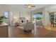 Bright and airy living room with hardwood floors and access to the backyard at 176 Brookshire Dr, Lake Wales, FL 33898