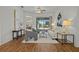 Bright living room with hardwood floors, comfy seating, and a view of the pool at 176 Brookshire Dr, Lake Wales, FL 33898