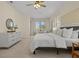 Main bedroom with king bed, dresser, and access to a private sitting area at 176 Brookshire Dr, Lake Wales, FL 33898