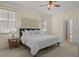 Main bedroom featuring a king-size bed and ensuite bathroom access at 176 Brookshire Dr, Lake Wales, FL 33898
