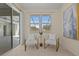 Peaceful sitting area with two armchairs and access to the pool area at 176 Brookshire Dr, Lake Wales, FL 33898