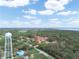 Scenic aerial view showcasing the condo complex nestled amidst lush green trees and serene natural surroundings at 2002 Granada Ct # 1, Lake Wales, FL 33898