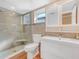 Modern bathroom featuring a tiled shower with glass door and a vanity with storage at 2002 Granada Ct # 1, Lake Wales, FL 33898