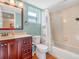Bright bathroom featuring a tub and shower combination and a vanity with storage at 2002 Granada Ct # 1, Lake Wales, FL 33898