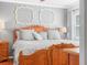 Charming main bedroom with ornate wood furniture and neutral décor at 2002 Granada Ct # 1, Lake Wales, FL 33898