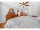 Spacious main bedroom with a ceiling fan, hard wood floors and a large mirror at 2002 Granada Ct # 1, Lake Wales, FL 33898