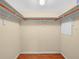 A well-organized closet with rod and shelving provides ample storage space at 2002 Granada Ct # 1, Lake Wales, FL 33898