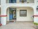 Inviting entrance with blue door, decorative wreath, and large window for natural light at 2002 Granada Ct # 1, Lake Wales, FL 33898