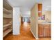 Hallway featuring a closet and leading into a living area with wood floors and modern lighting at 2002 Granada Ct # 1, Lake Wales, FL 33898