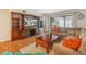 Inviting living room with custom built-ins, a large window, and comfortable seating at 2002 Granada Ct # 1, Lake Wales, FL 33898