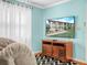 Cozy living room with neutral tones and a large television at 2002 Granada Ct # 1, Lake Wales, FL 33898