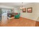 Bright living room with wood floors, a comfortable sectional sofa, and plenty of natural light at 2002 Granada Ct # 1, Lake Wales, FL 33898