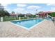 Inviting community pool with lounge chairs and a gazebo, ideal for outdoor relaxation at 2002 Granada Ct # 1, Lake Wales, FL 33898