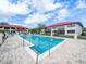 Community pool area featuring comfortable lounge chairs and a charming gazebo, perfect for relaxing at 2002 Granada Ct # 1, Lake Wales, FL 33898