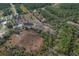 Aerial view of a property showing a pond and surrounding natural landscape at 208 Limpkin Ln, Frostproof, FL 33843