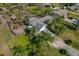 Aerial view of an expansive backyard with plenty of space, palm trees, shed, and fence at 208 Limpkin Ln, Frostproof, FL 33843