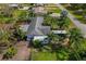 Spacious backyard with lush greenery and a convenient location nearby lush trees and other homes at 208 Limpkin Ln, Frostproof, FL 33843