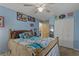 Bright bedroom featuring a ceiling fan, closet, and coordinated horse-themed decor at 208 Limpkin Ln, Frostproof, FL 33843