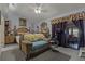 Bedroom with wooden furniture, carpet, and natural light at 208 Limpkin Ln, Frostproof, FL 33843
