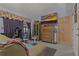 Bedroom with wooden furniture, carpet and access to a sunroom at 208 Limpkin Ln, Frostproof, FL 33843