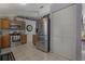 Modern kitchen featuring stainless steel appliances, ample cabinet space, and tiled flooring at 208 Limpkin Ln, Frostproof, FL 33843
