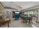Cozy living room with bright, natural light, tile flooring, and comfortable seating at 208 Limpkin Ln, Frostproof, FL 33843