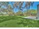 Spacious backyard with large oak trees at 21113 Kissimmee Shores Rd, Lake Wales, FL 33898