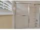 Bathroom with shower/tub combo and frosted glass shower door at 21113 Kissimmee Shores Rd, Lake Wales, FL 33898