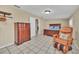 Bedroom with a dresser, massage chair and tiled floors at 21113 Kissimmee Shores Rd, Lake Wales, FL 33898