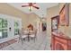 Charming breakfast nook with glass table and chairs, adjacent to kitchen at 21113 Kissimmee Shores Rd, Lake Wales, FL 33898
