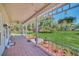 Front porch with tiled floor and view of the backyard at 21113 Kissimmee Shores Rd, Lake Wales, FL 33898