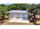 Detached three-car garage with concrete pad at 21113 Kissimmee Shores Rd, Lake Wales, FL 33898